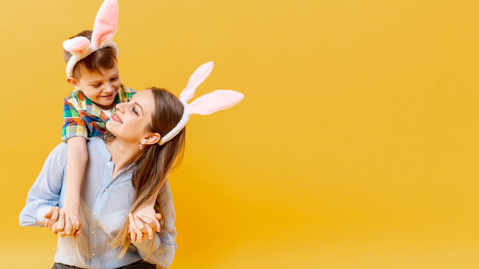 copy-space-mother-son-with-rabbit-ears-looking-each-other